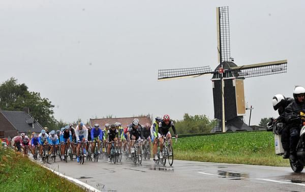 The Vuelta a Espa&ntilde;a passes a windmill in The Netherlands.