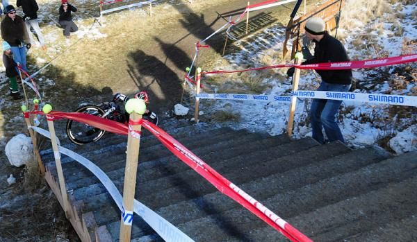Katie Compton (Planet Bike) falls on the bottom step but recovers.