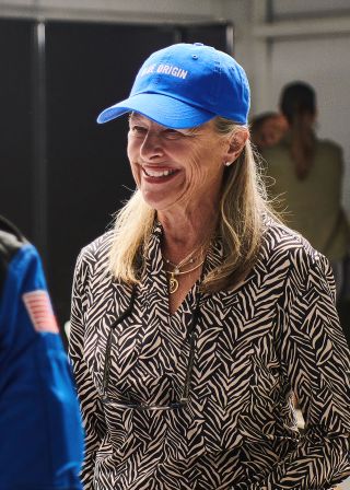 Laura Shepard Churchley, the eldest daughter of the first American in space Alan Shepard, is seen wearing a Blue Origin cap at the first human flight of the company's New Shepard launch vehicle in July 2021. Churchley is set to follow in her father's footsteps, flying on Blue Origin's third crewed flight in December.