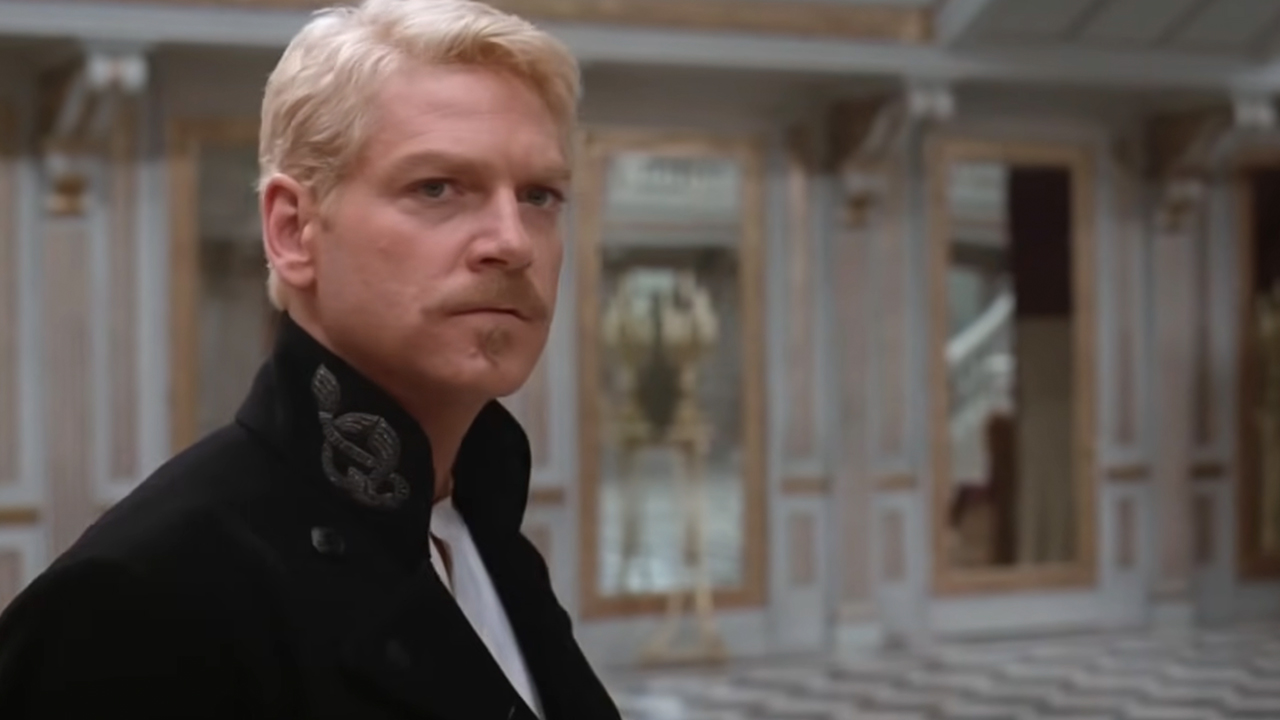 Kenneth Branagh with blonde hair looking past the camera in Hamlet.