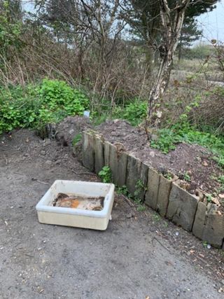 A reclaimed sink at the side of the road