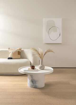 white living room with modern white sofa and cork floor