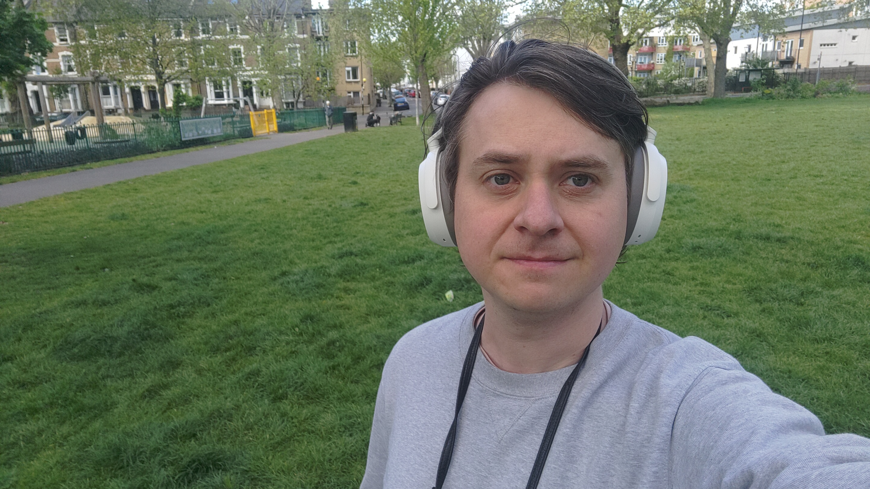Selfie of man wearing Sennheiser Momentum 4 headphones