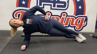 Woman holding a side plank position