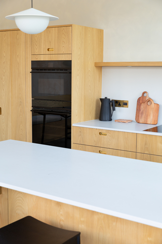 wooden kitchen cabinets and white island