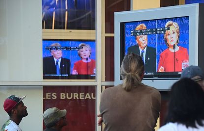 People watch the first presidential debate on TV.
