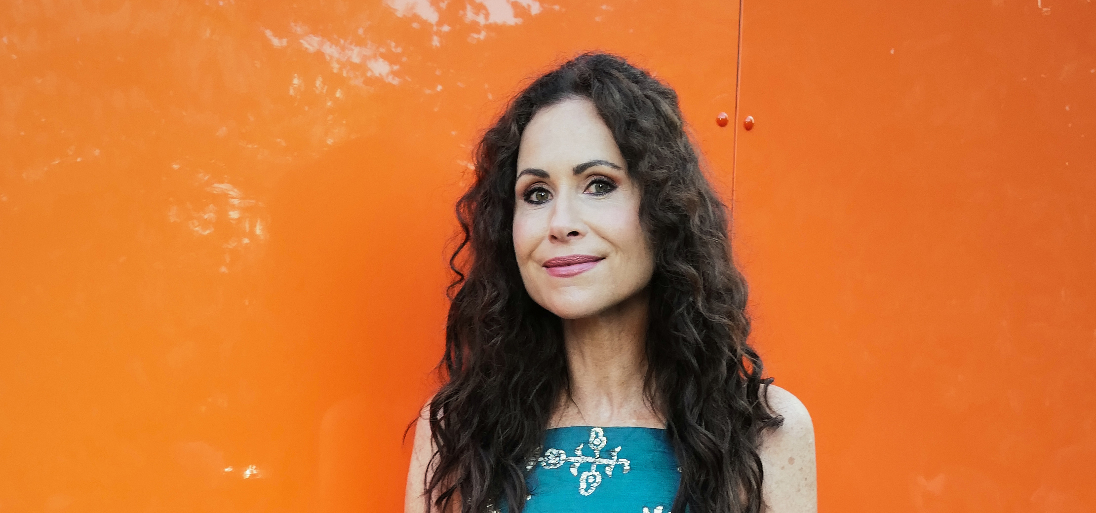Minnie Driver wearing a blue dress 