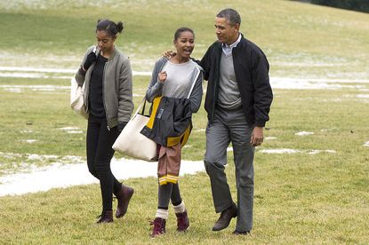 President Obama with his daughters.
