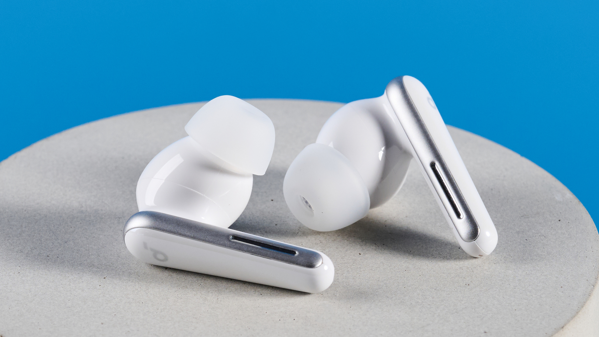 The Soundcore Liberty 5 photographed in front of a blue background.