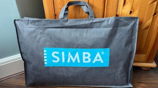 The Simba Stratos Pillow in its storage bag