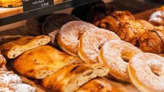 Pastries like doughnuts sitting on tray