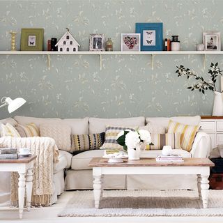 living room with sofa and wall shelf