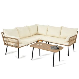 A YITAHOME 4 Pcs Patio Sofa set - a rattan and woven canes sectional with a rattan table
