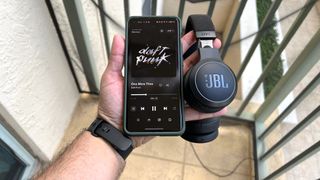 JBL Live 670NC headhones with smartphone streaming Daft Punk for sound quality assessment