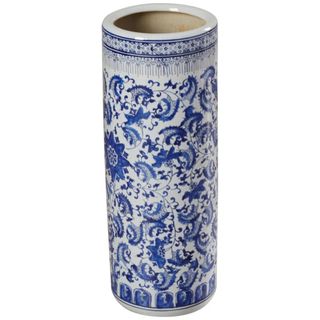 A white ceramic umbrella stand with blue Ming style floral decoration all over