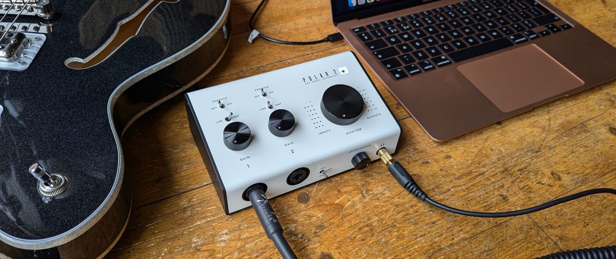 A Blackstar Polar 2 on a wooden floor with a MacBook and semi-hollow guitar