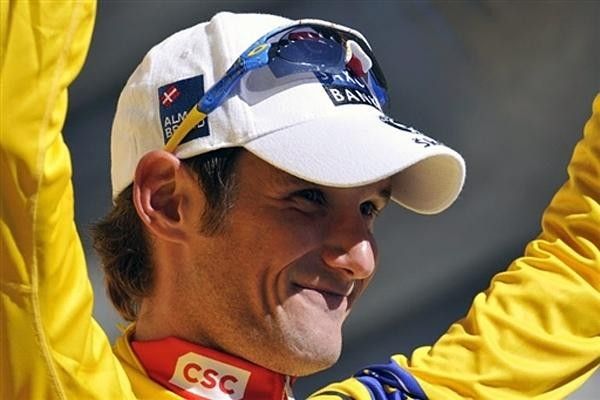 Overall leader Frank Schleck (Team CSC - Saxo Bank) celebrates another day in yellow on the podium.