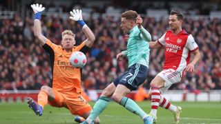 Aaron Ramsdale of Arsenal makes a save from Harvey Barnes of Leicester City during a Premier League match between Arsenal and Leicester City.