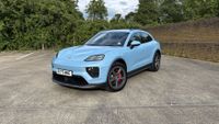 Porsche Macan electric in blue in a car park
