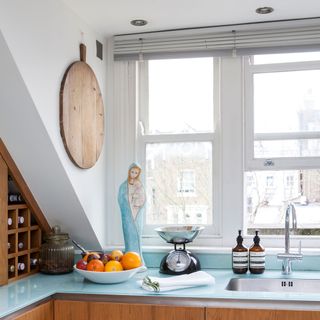 kitchen with wooden cabinets and glass worktop