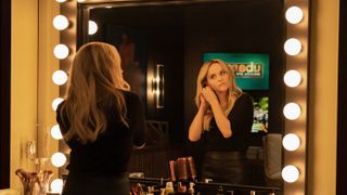 Reese Witherspoon looking in a mirror in The Morning Show season 3