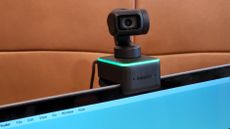 Insta360 Link mounted on MacBook Pro display.