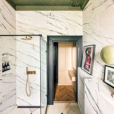 Bathroom with chequered floor, tiled shower and walls and dark green ceiling