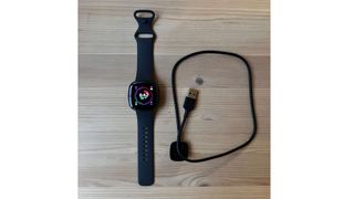 Fitbit Sense 2 laid flat with charging cable