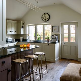 kitchen cream cabinets with wooden flooring