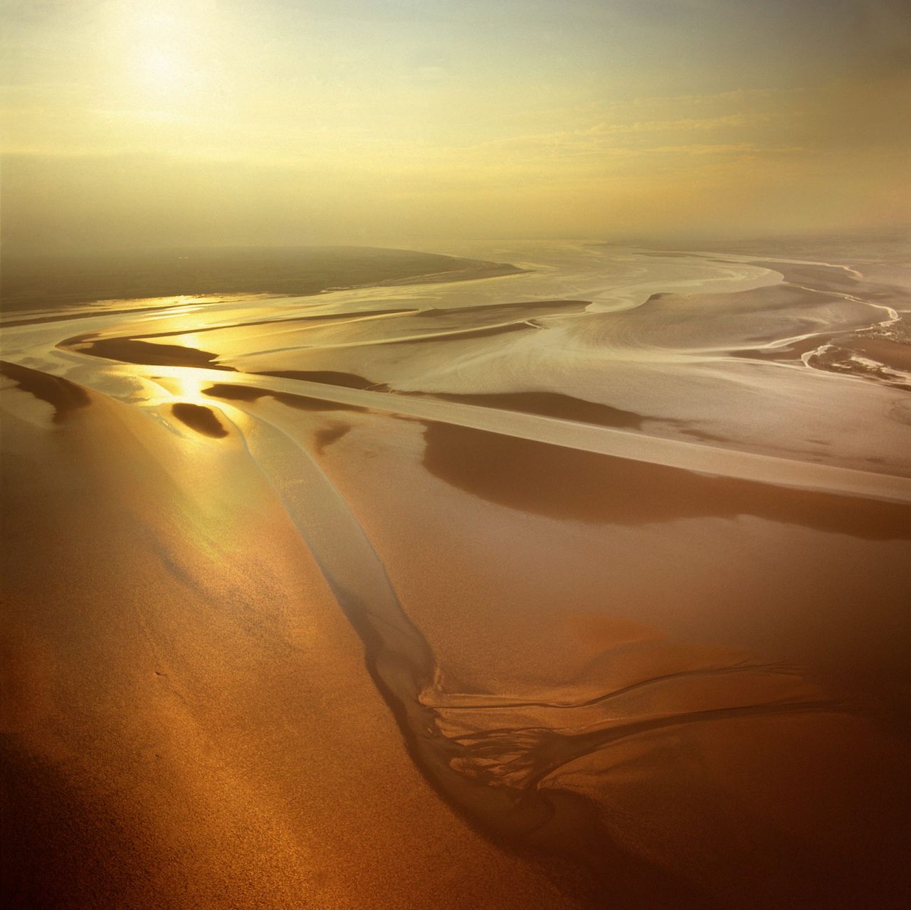 The mudflats at sunset, Solway Firth, the border between Cumbria in England and Dumfries and Galloway in Scotland.