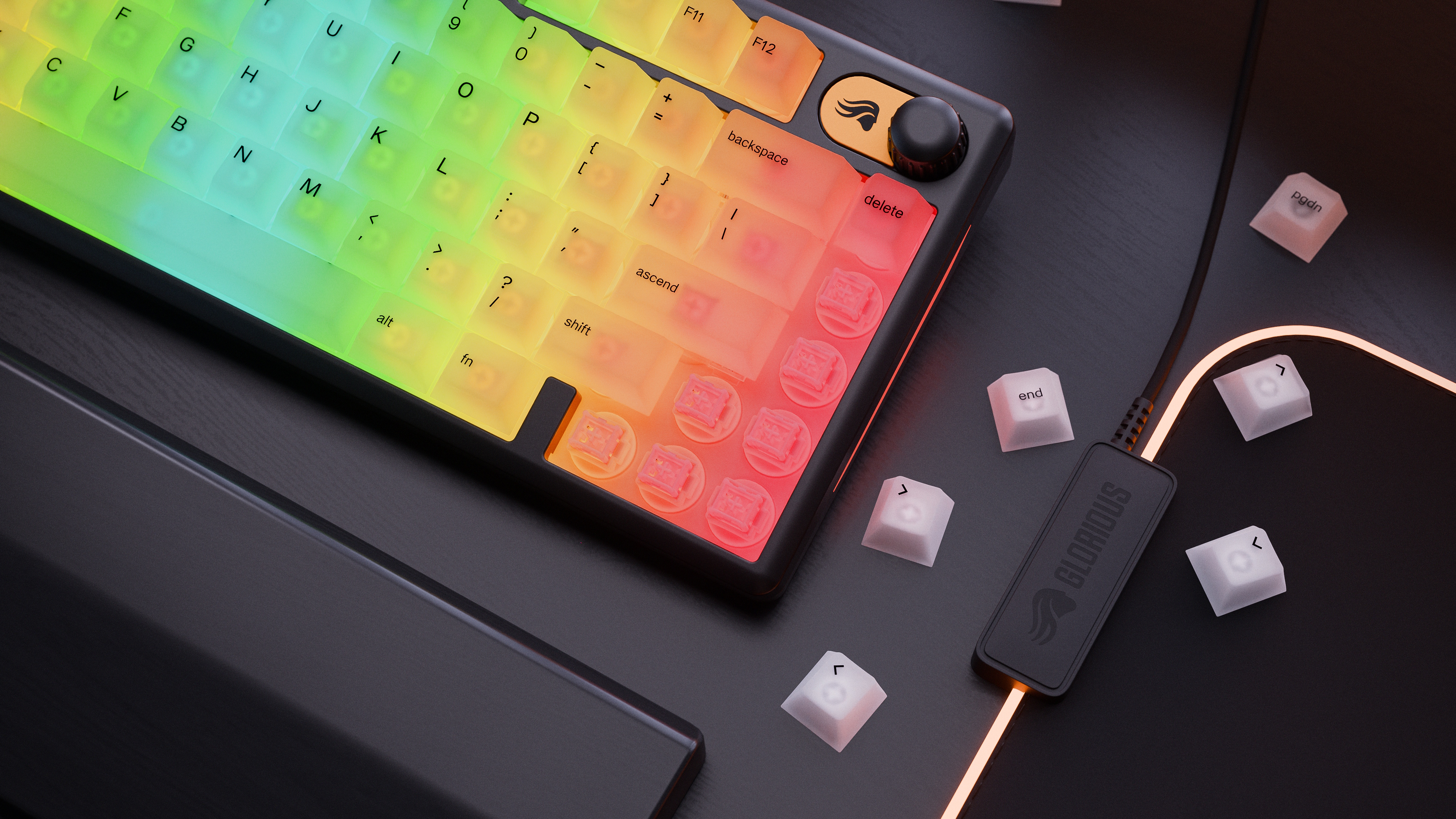 A Glorious GMBK 75% gaming keyboard with some keycaps scattered off to the side