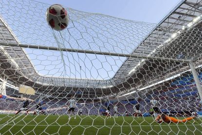 Argentina's goalkeeper Franco Armani (R) eyes the ball after conceding the fourth goal to France during the Russia 2018 World Cup round of 16 football match between France and Argentina at th