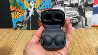 Samsung Galaxy Buds 2 Pro in hand in testing room