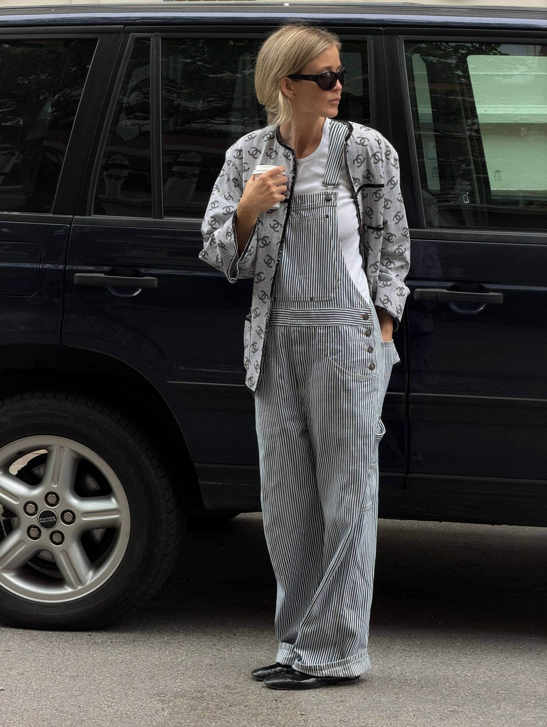 Josefine wears striped overalls and a Chanel jacket.