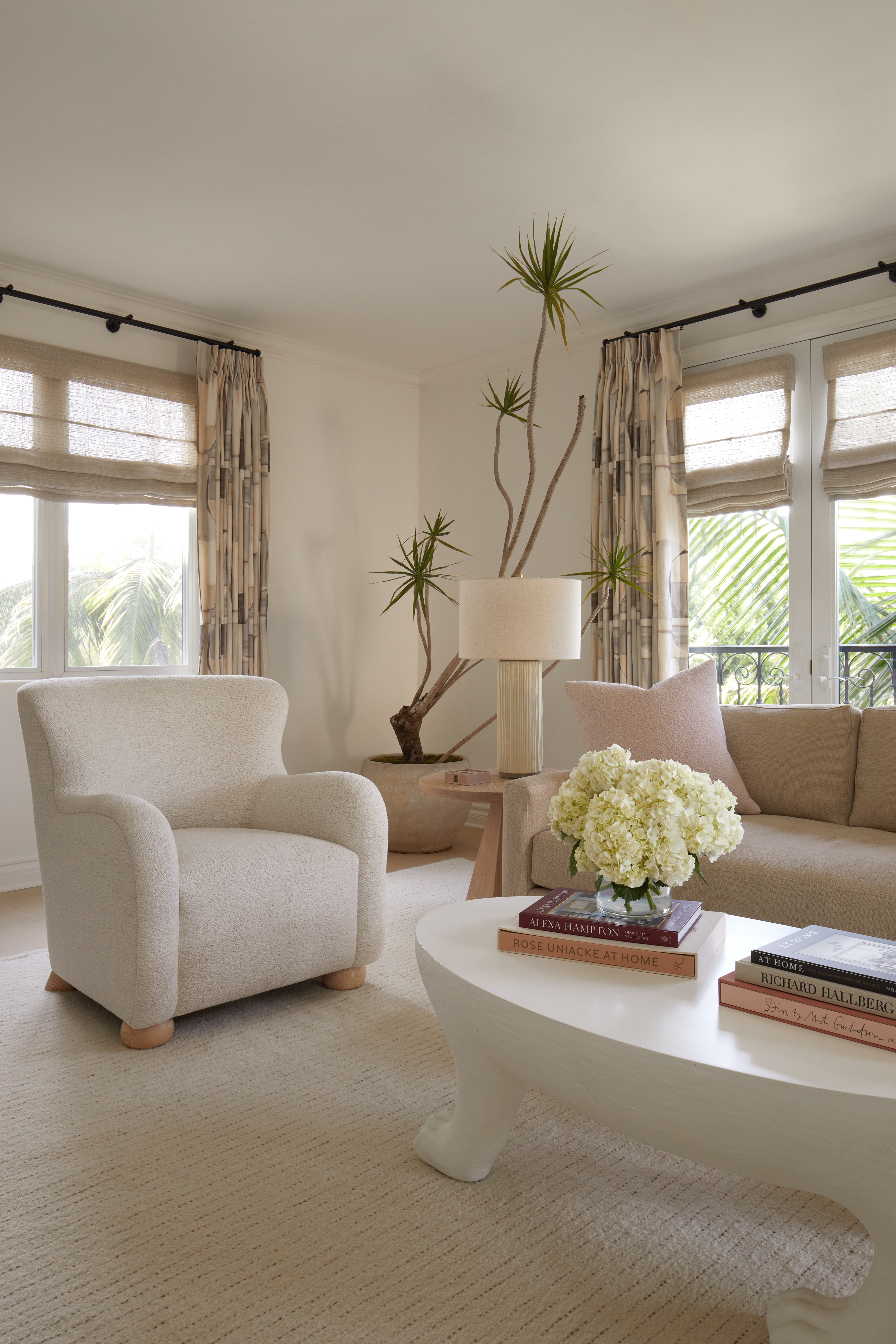 Cream boucle armchair in a very neutral toned living room.