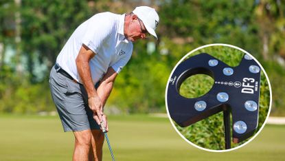 Phil Mickelson hits a putt with an insert of a LAB Golf putter