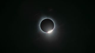 totality of a solar eclipse, like an upside down diamond ring.