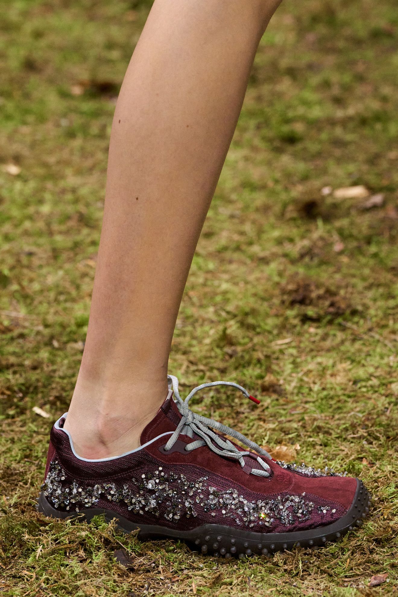 Miu Miu model burgundy trainers