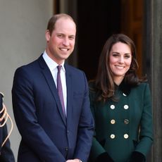 Prince William and Kate Middleton smile outside the Elysee Palace during their 2017 visit to Paris