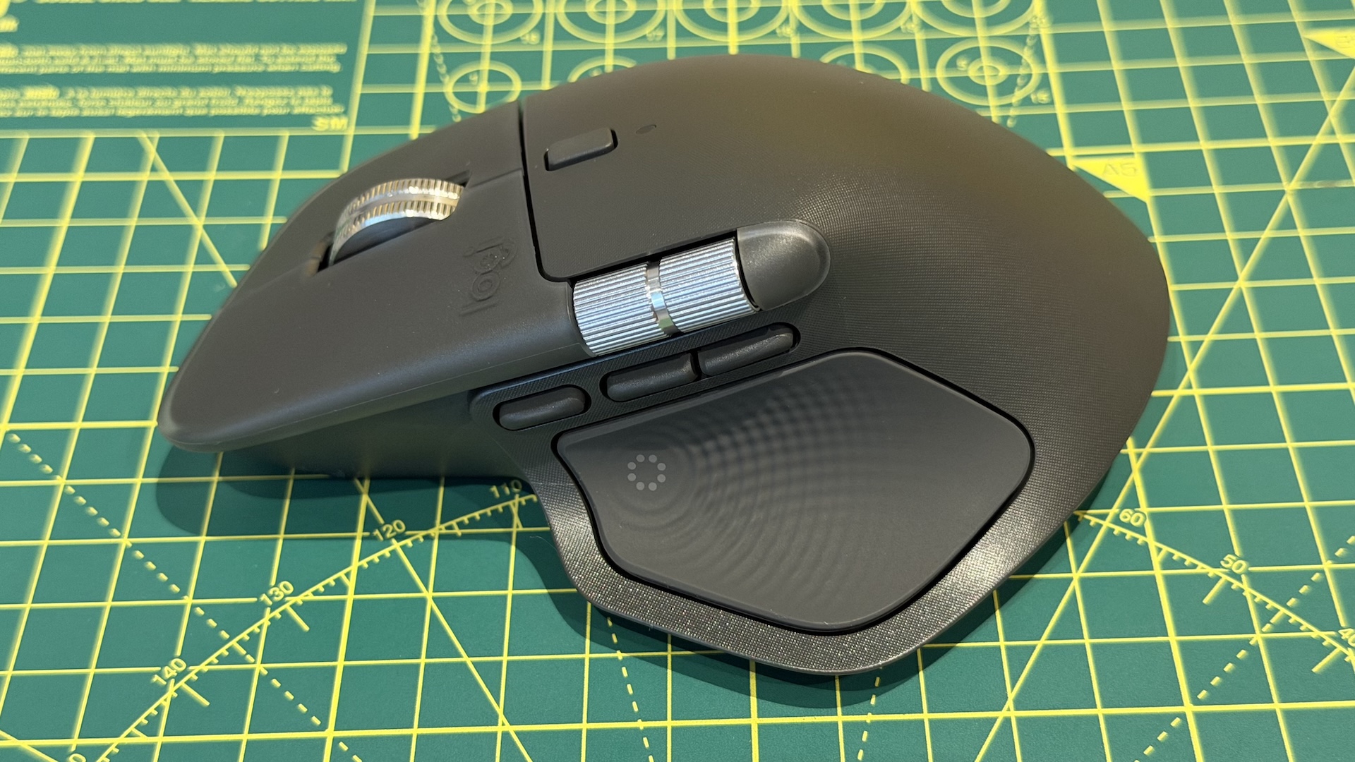 The Logitech MX Master 4 mouse on a graphing grid