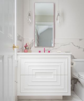 Timeless bathroom scheme with hot pink accents and faucet