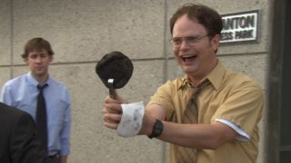 Dwight holding up the burnt pita in The Office