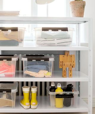 clear storage boxes in walk-in wardrobe