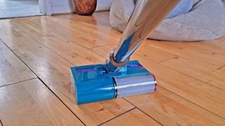 Dyson V15s Detect wet dry vacuum cleaner on hardwood floor
