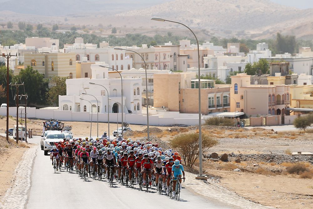 The peloton passes through the town of Ghala during stage one of the 2016 Tour of Oman