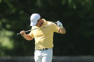 Rory McIlroy of Northern Ireland reacts to a shot from the 14th fairway during the final round of the Memorial Tournament