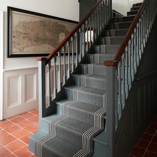 Terracotta hallway flooring with stairs