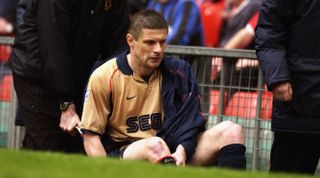 14 Apr 2002: Oleg Luzhny of Arsenal leaves the field on a stretcher during the AXA FA Cup Semi Final match between Arsenal and Middlesbrough at Old Trafford, Manchester. Arsenal won the match 1 - 0. DIGITAL IMAGE. \ Mandatory Credit: Ross Kinnaird/GettyImages