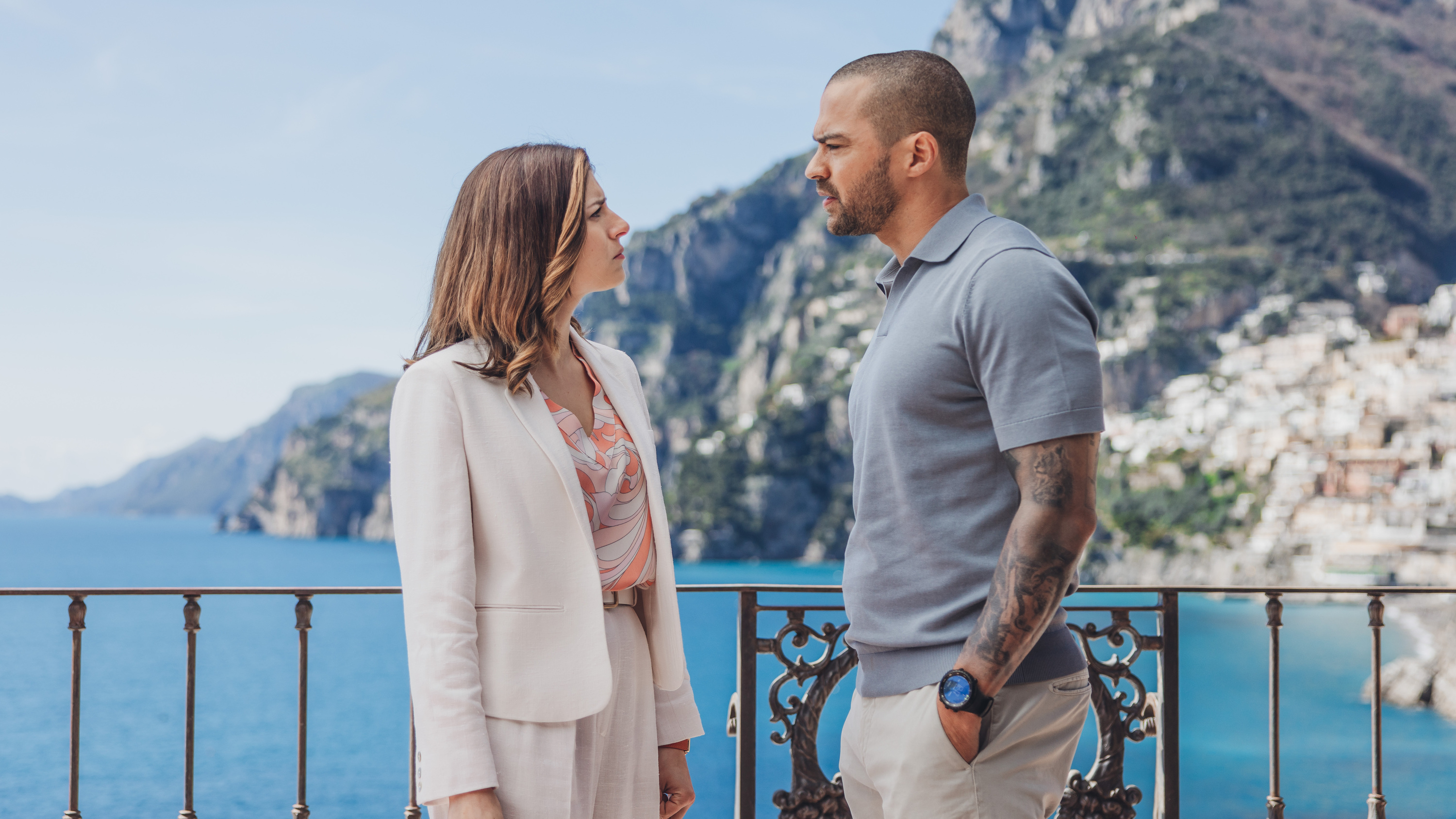 Daniel De Luca (Jesse Williams, right) chats with a hotel staff member in a scene from Prime Video&#039;s &quot;Hotel Costiera&quot;