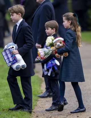 Prince George, Prince Louis, Princess Charlotte carry armfuls of gifts from royal fans at Sandringham on Christmas Day